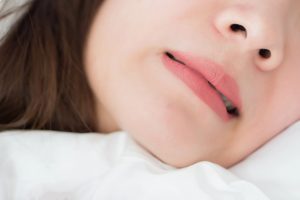 Close up of woman grinding teeth