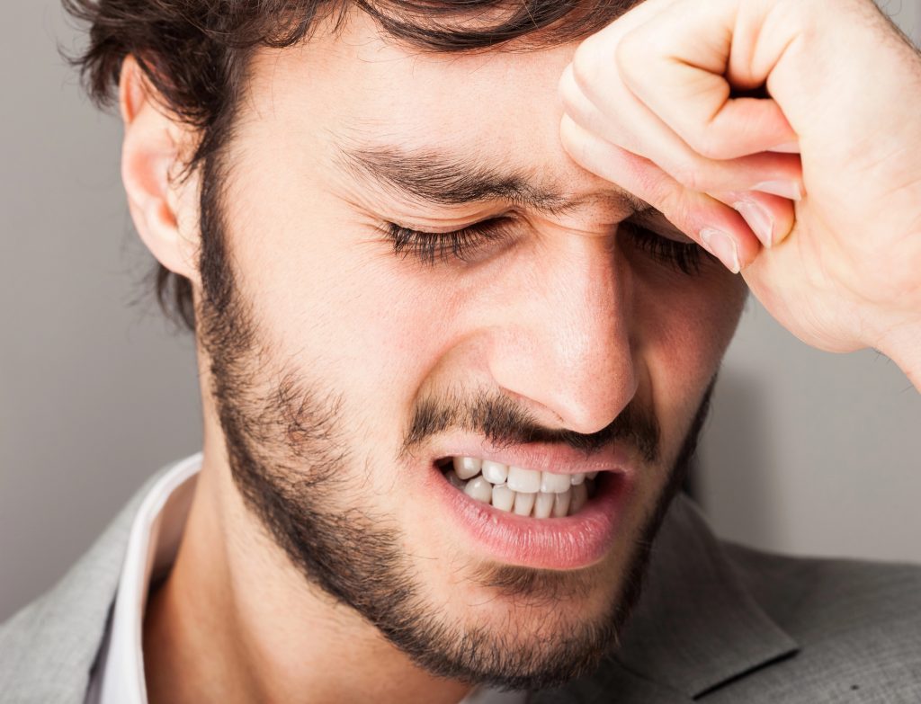 Man looking stressed.