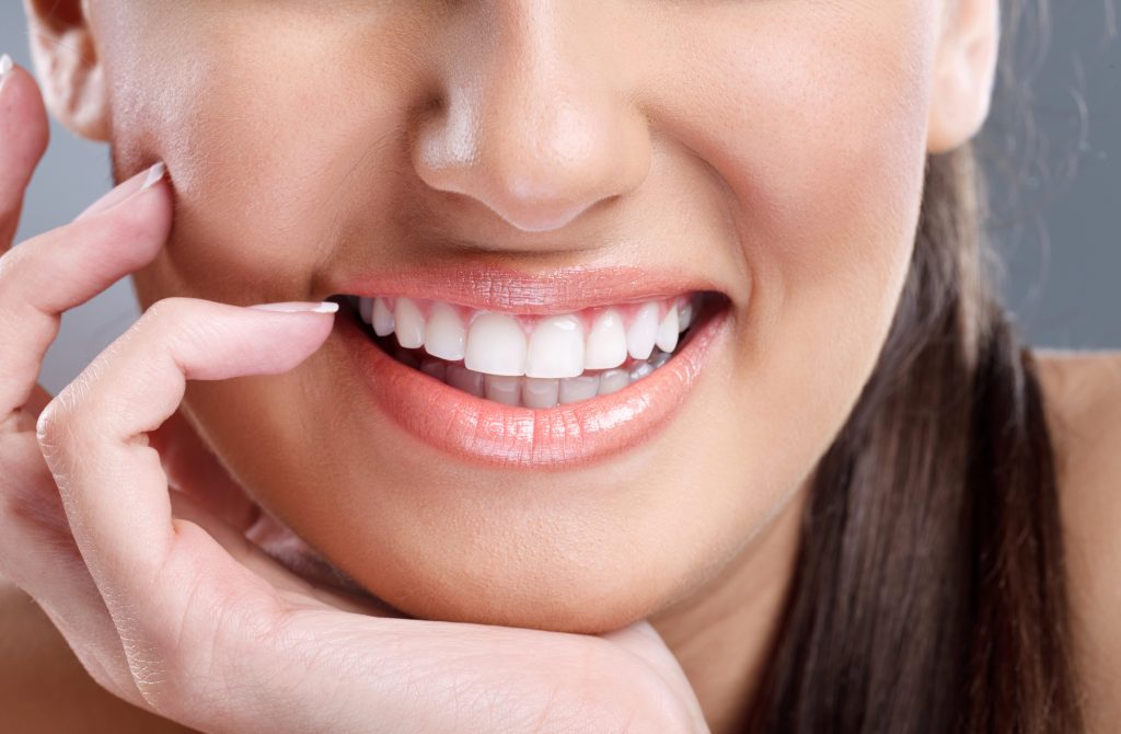 Close up of woman with white healthy teeth, 